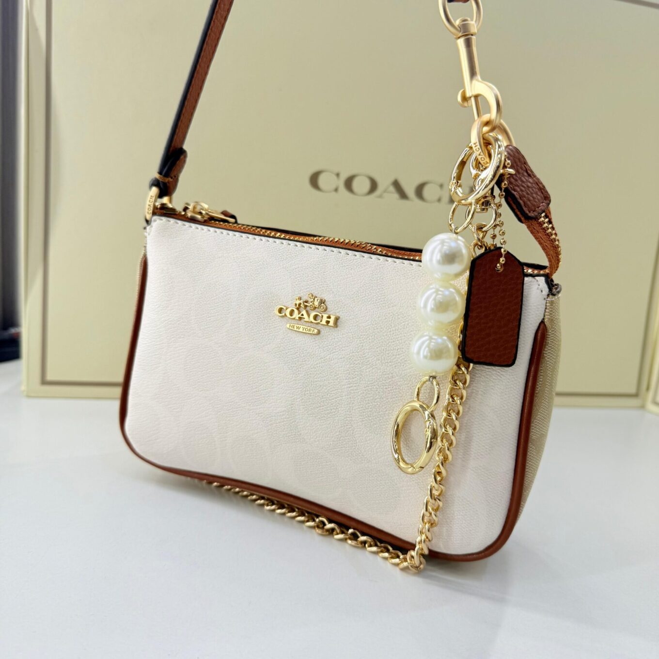 WhatsApp Image 2025-09-05 at 2.36.35 PM (1) Coach Nolita 19 Apricot White Shoulder Bag (With Box)