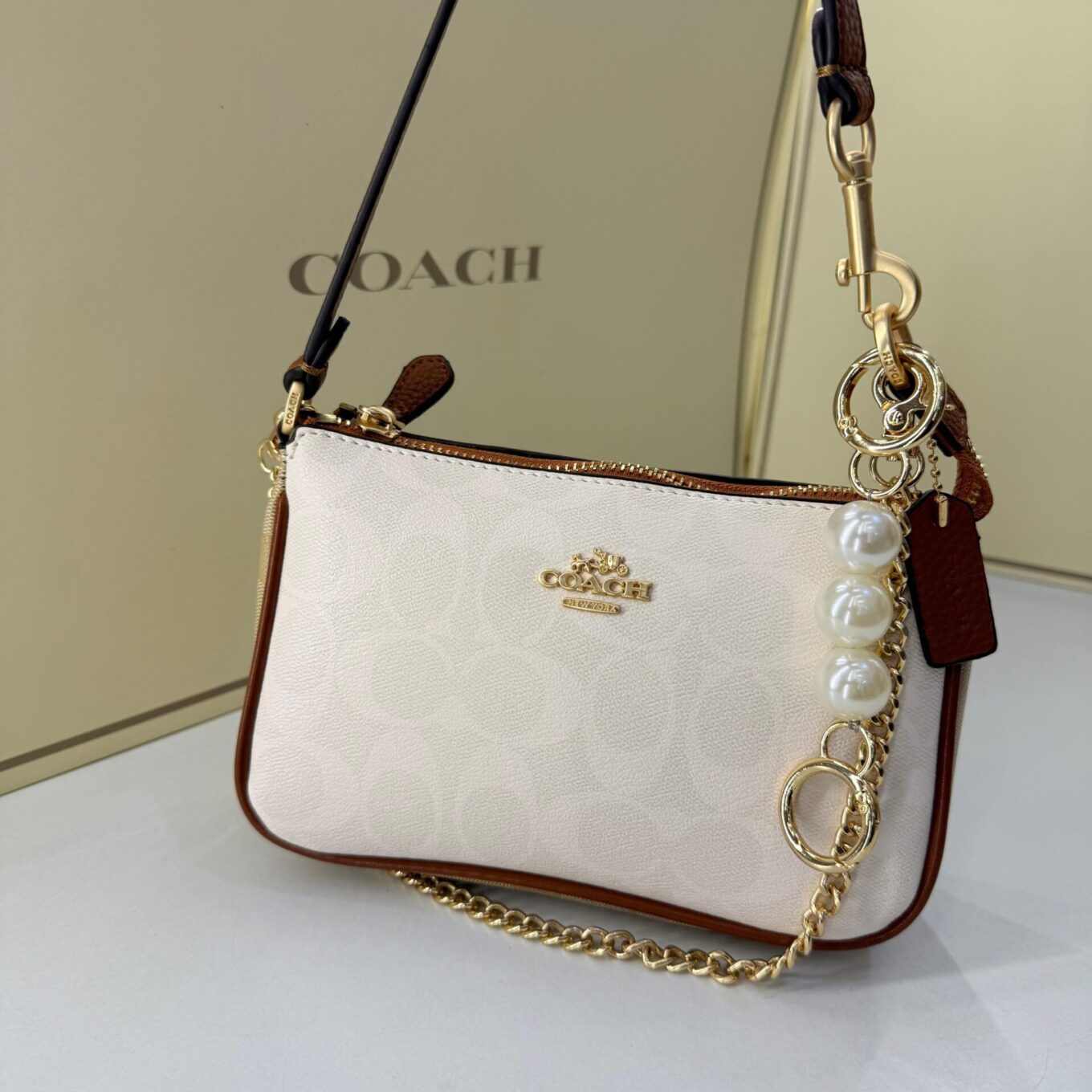WhatsApp Image 2025-09-05 at 2.36.35 PM (2) Coach Nolita 19 Apricot White Shoulder Bag (With Box)